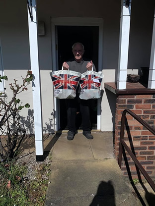 resident 1 receiving food parcel from Welfare Rights referral