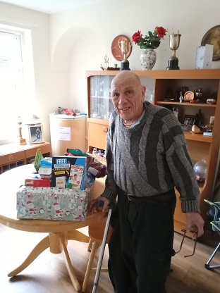 resident 2 receiving food parcel from Welfare Rights referral